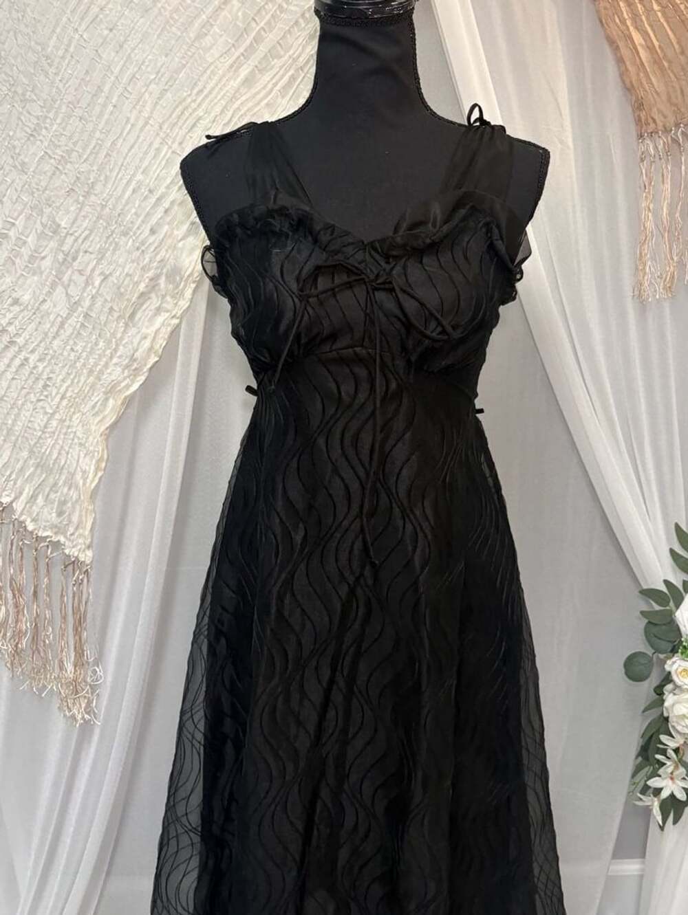 Black midi dress with ruffles and front tie